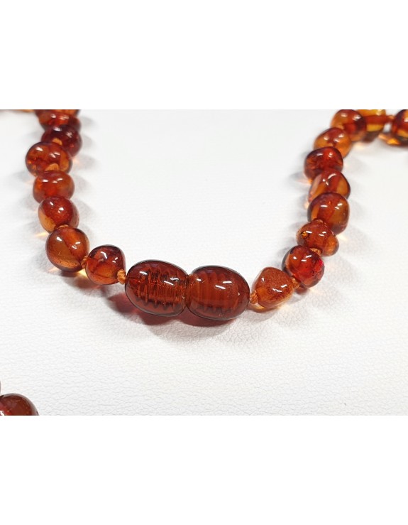 Polished cognac Baltic amber necklace with Lava